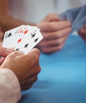 depositphotos_115224334-stock-photo-retired-people-playing-card