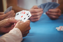 depositphotos_115224334-stock-photo-retired-people-playing-card